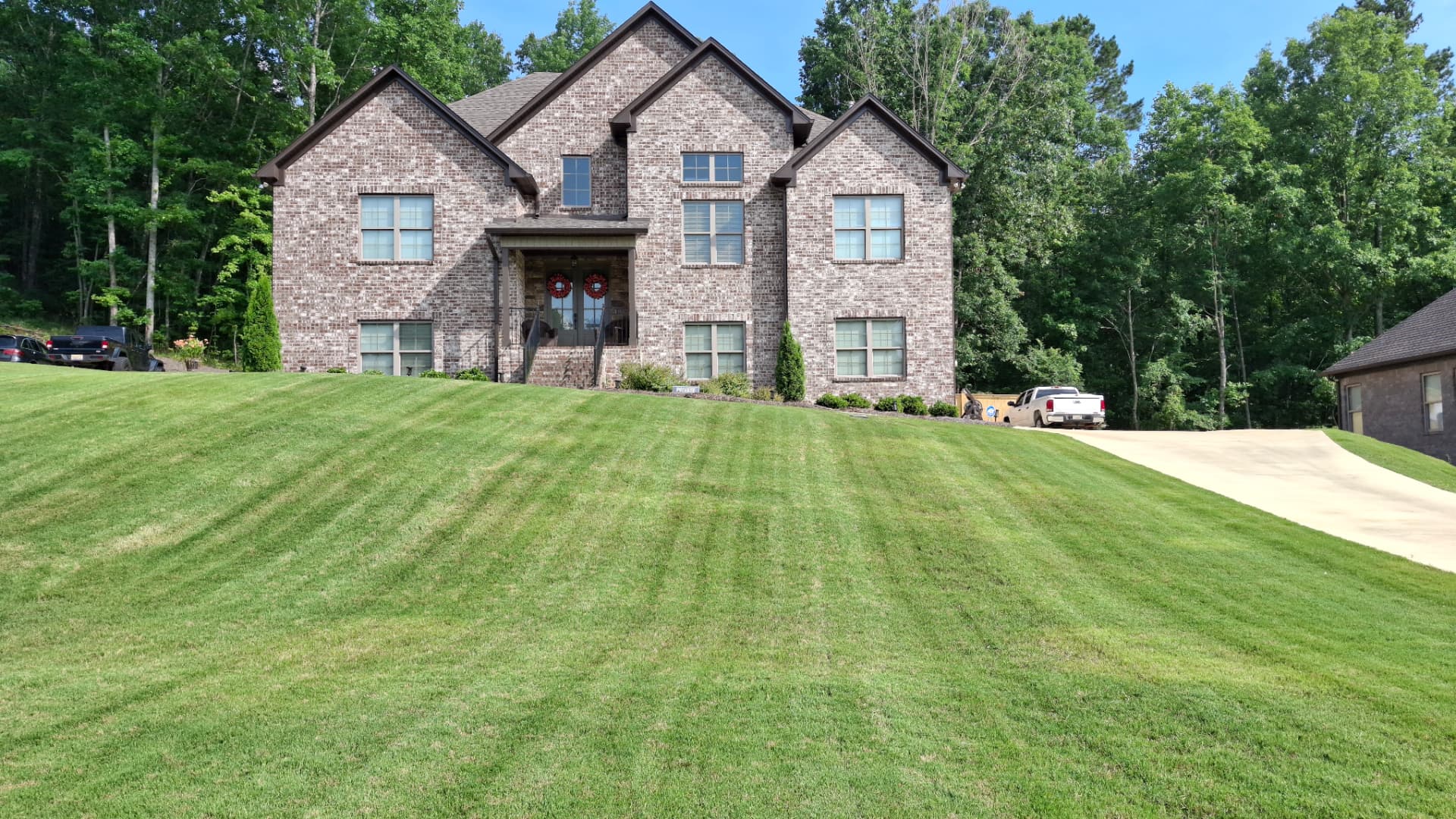 Signature Lawns crew maintaining a suburban lawn in Shelby County, AL
